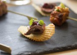 Venison and red currant sauce on game chips